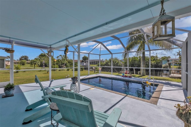 pool with glass enclosure, a patio, and a yard