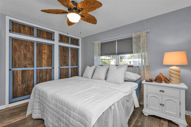 bedroom with dark wood-style flooring and ceiling fan