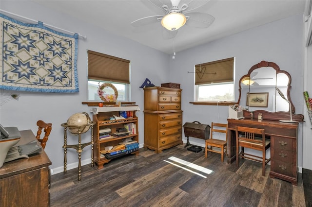 home office with a ceiling fan, wood finished floors, and baseboards