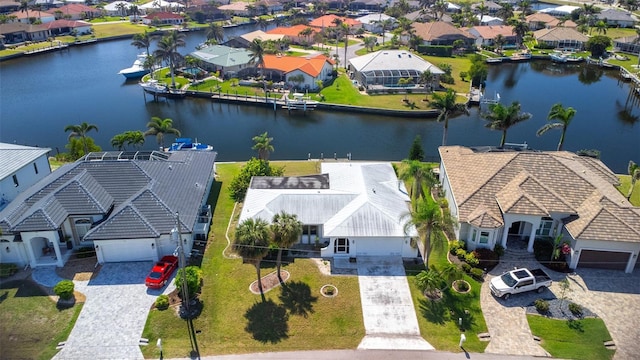 aerial view featuring a residential view and a water view