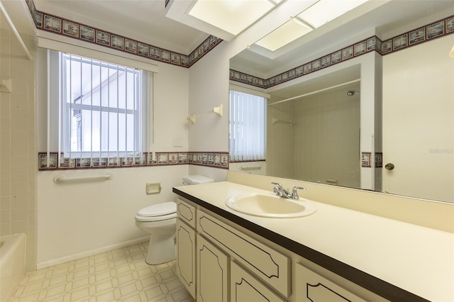 full bathroom with tile patterned floors, toilet, shower / bathing tub combination, baseboards, and vanity