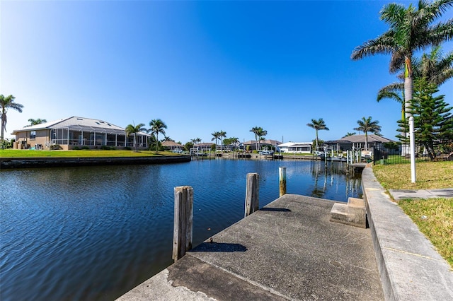 dock area with a residential view and a water view