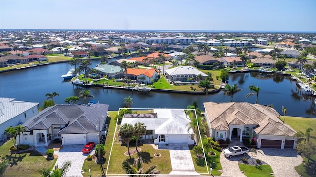 bird's eye view with a residential view and a water view