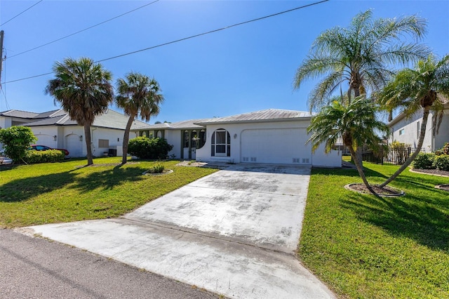 single story home with concrete driveway, an attached garage, and a front lawn