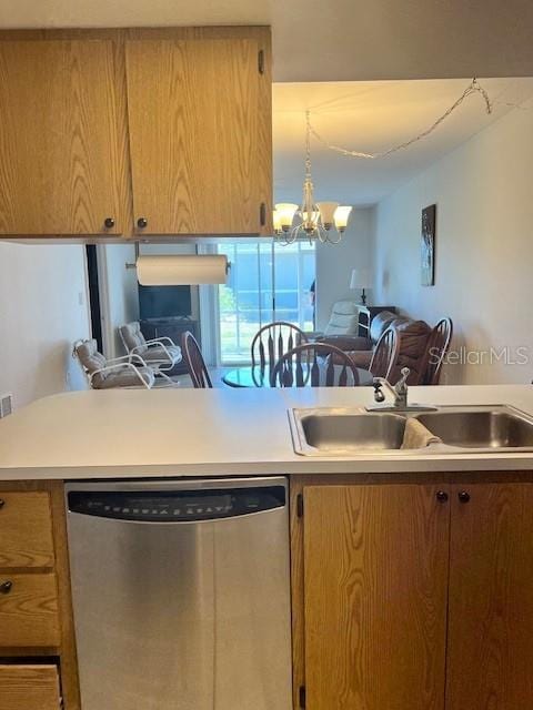 12274 SW Egret Cir Unit 3703, Lake Suzy, FL 34269 - kitchen with dishwasher, a sink, light countertops, and a chandelier