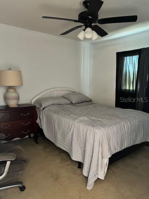 12274 SW Egret Cir Unit 3703, Lake Suzy, FL 34269 - bedroom featuring carpet and ceiling fan