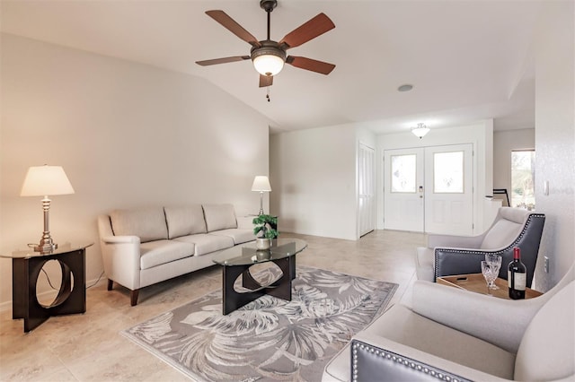 living area featuring french doors, a ceiling fan, and vaulted ceiling