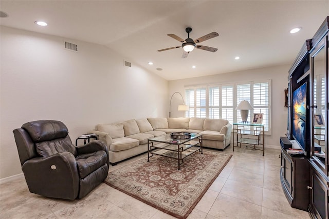 living room with light tile patterned floors, visible vents, a ceiling fan, and vaulted ceiling