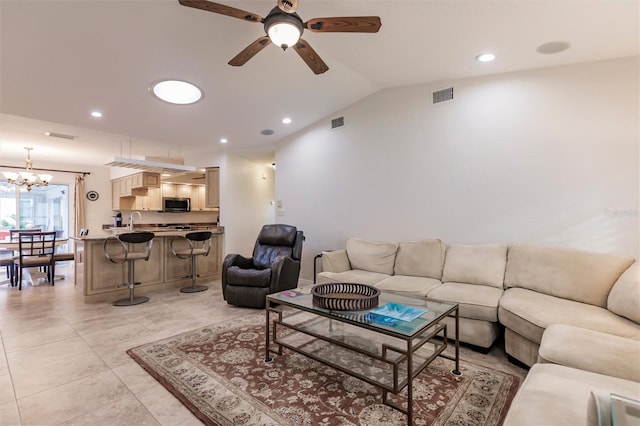 living area featuring recessed lighting, visible vents, ceiling fan with notable chandelier, and lofted ceiling