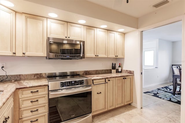 kitchen featuring light tile patterned floors, baseboards, visible vents, recessed lighting, and stainless steel appliances