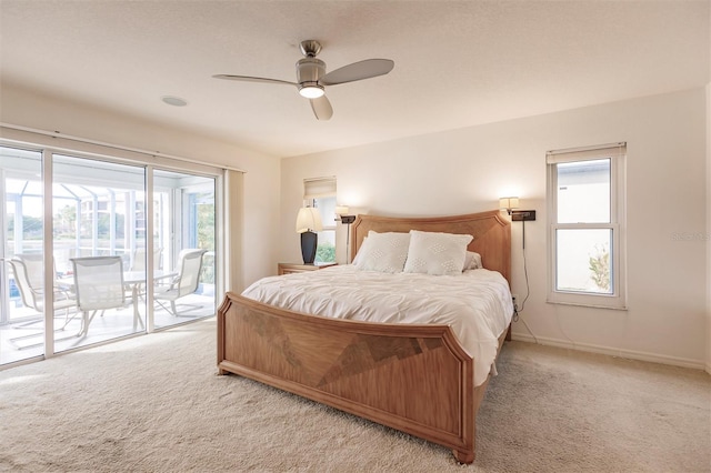 bedroom featuring access to outside, baseboards, carpet floors, and ceiling fan