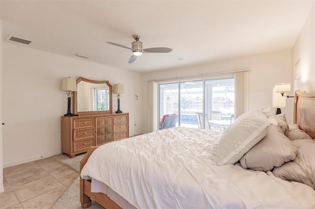 bedroom featuring visible vents, baseboards, light tile patterned floors, a ceiling fan, and access to outside