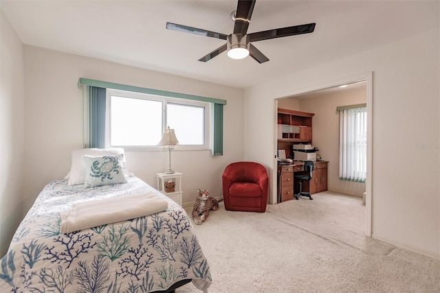 bedroom with carpet flooring, multiple windows, and a ceiling fan