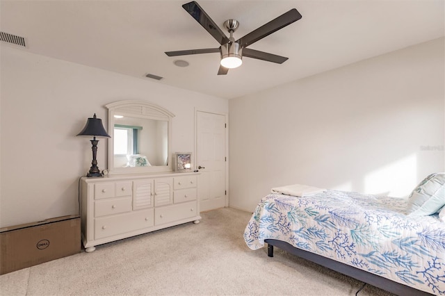 bedroom with a ceiling fan, light colored carpet, and visible vents