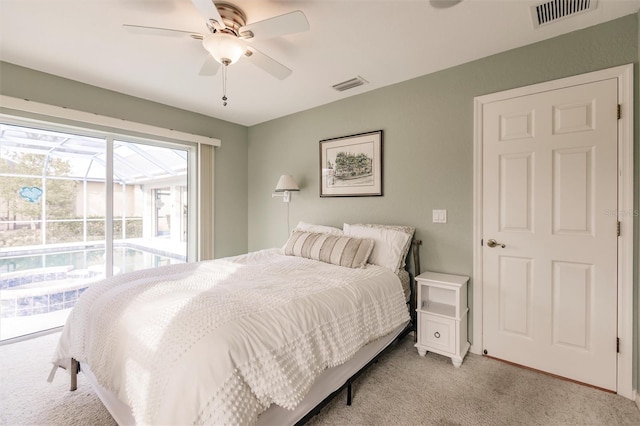 bedroom featuring access to exterior, visible vents, light carpet, and a ceiling fan