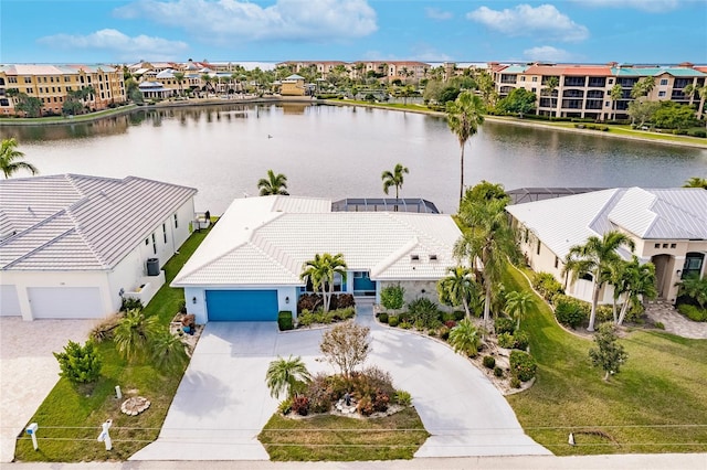 aerial view with a residential view and a water view