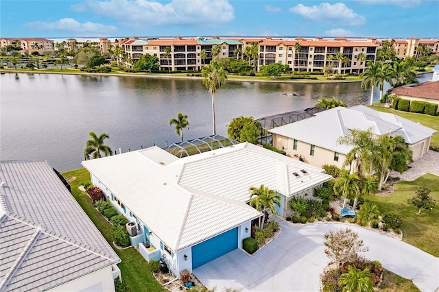 birds eye view of property with a residential view and a water view