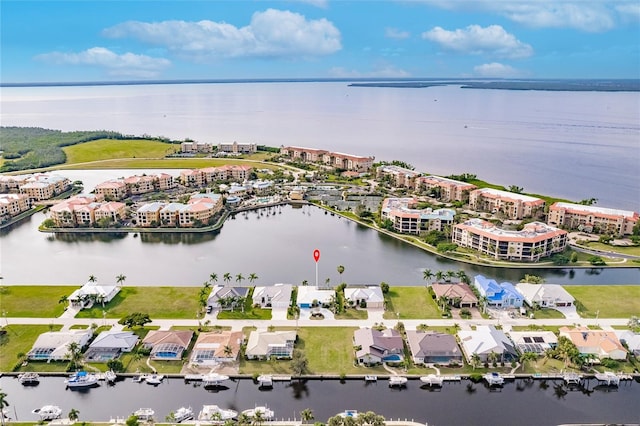 birds eye view of property featuring a residential view and a water view