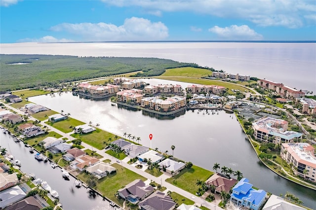 bird's eye view featuring a water view and a residential view