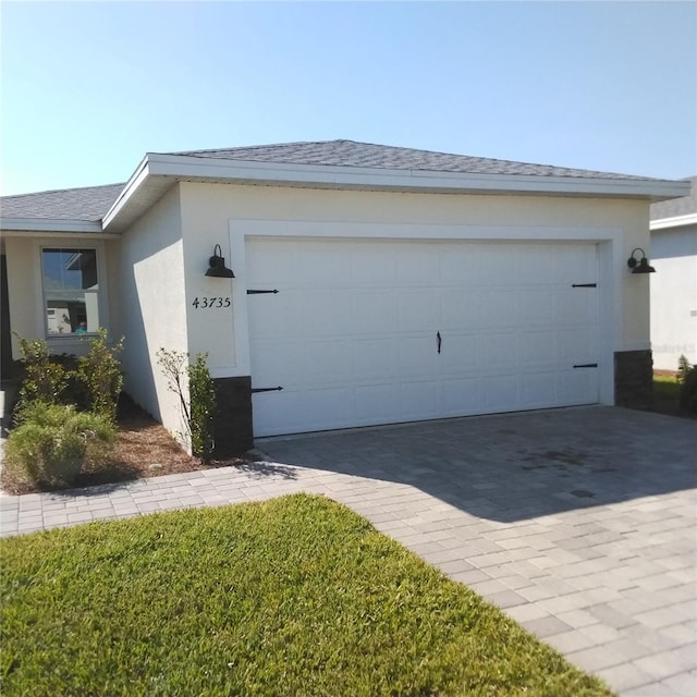 garage featuring driveway