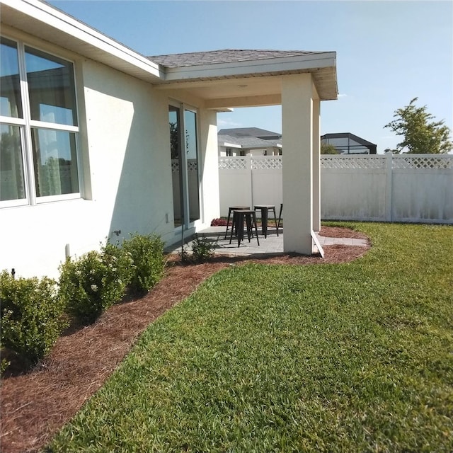 view of yard with a patio area and fence