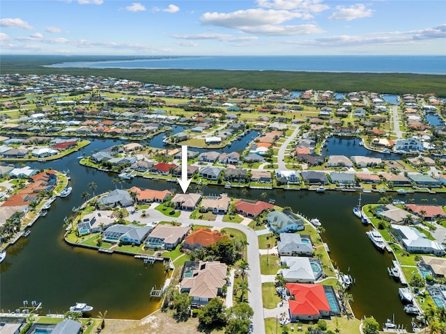 aerial view featuring a residential view and a water view