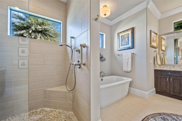 full bathroom featuring a freestanding tub, walk in shower, ornamental molding, and vanity