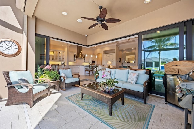 view of patio / terrace with grilling area, an outdoor hangout area, and a ceiling fan