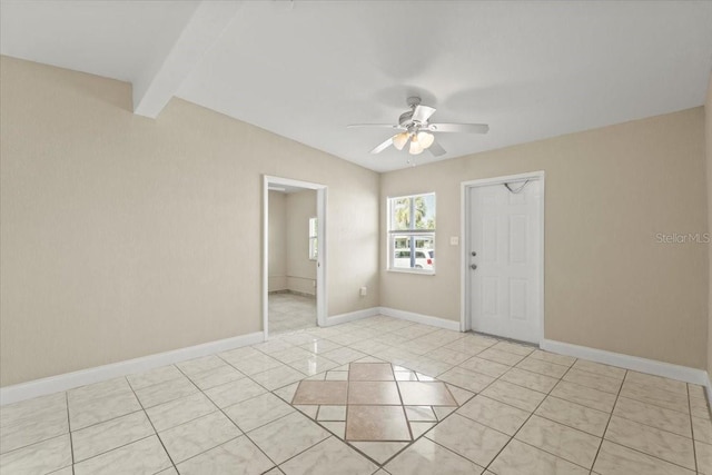 unfurnished room with light tile patterned floors, beam ceiling, baseboards, and ceiling fan