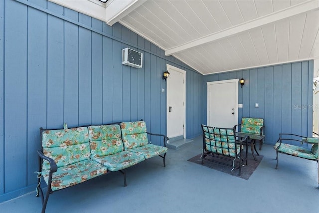 view of patio featuring an AC wall unit