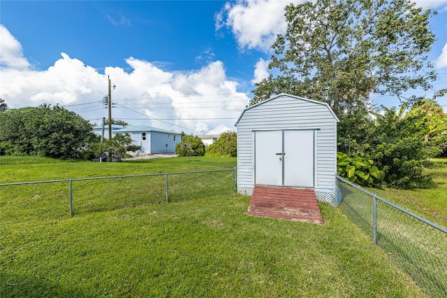 view of shed featuring a fenced backyard