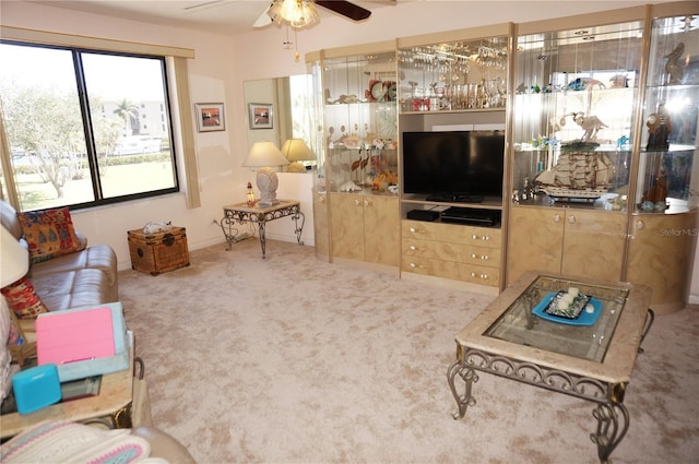 living room with carpet flooring and a ceiling fan