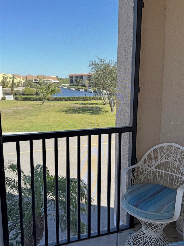 balcony featuring a water view