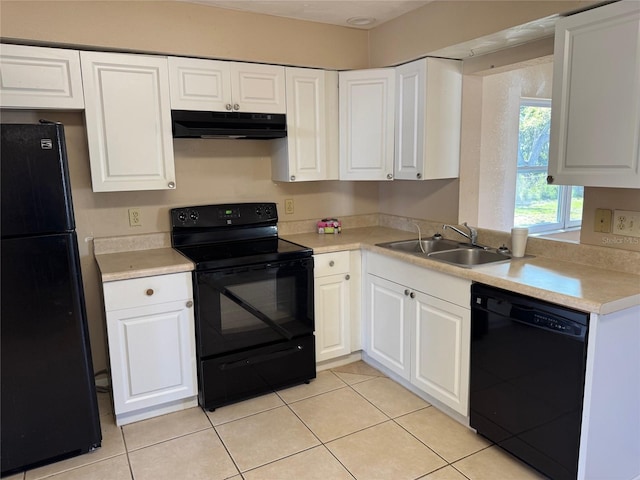 kitchen with black appliances, under cabinet range hood, light countertops, white cabinetry, and a sink