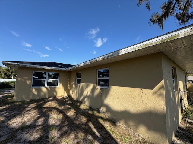 view of property exterior with stucco siding