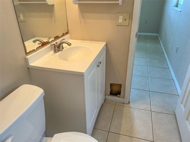 30147 Holly Rd, Punta Gorda, FL 33982 - bathroom with tile patterned floors, toilet, baseboards, and vanity