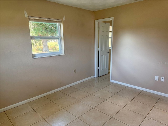 30147 Holly Rd, Punta Gorda, FL 33982 - unfurnished room featuring baseboards and light tile patterned floors