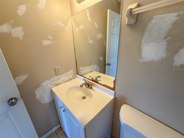 30147 Holly Rd, Punta Gorda, FL 33982 - bathroom with toilet, tile patterned floors, and vanity