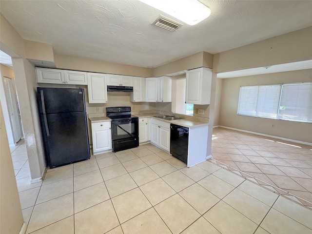 30147 Holly Rd, Punta Gorda, FL 33982 - kitchen with light countertops, visible vents, a sink, extractor fan, and black appliances
