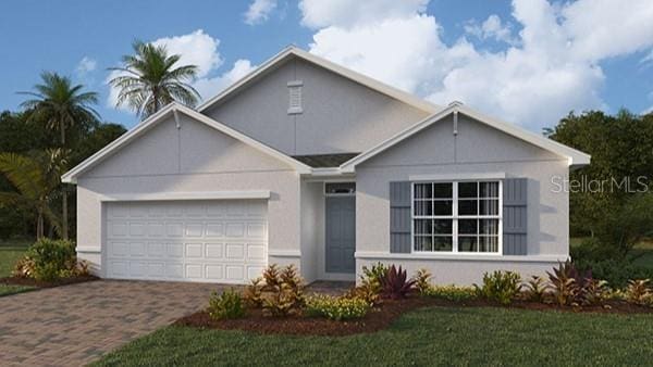 view of front of property featuring decorative driveway, an attached garage, and stucco siding