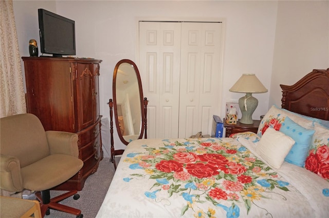 carpeted bedroom featuring a closet