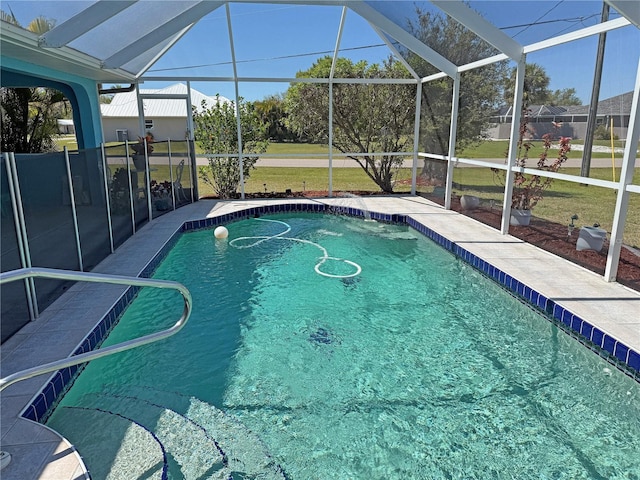 view of swimming pool featuring glass enclosure, a patio, and a fenced in pool