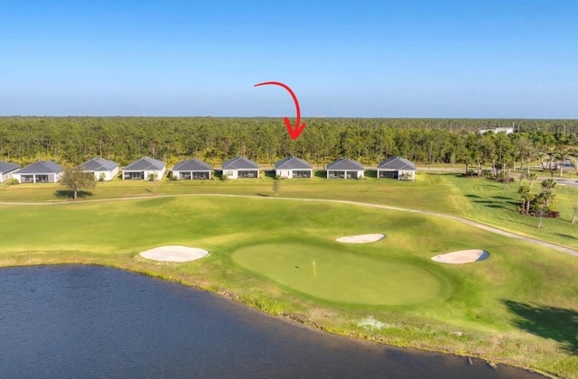14381 Heritage Landing Blvd, Punta Gorda, FL 33955 - view of home's community featuring golf course view, a water view, and a yard