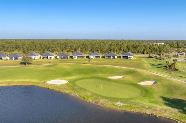 14381 Heritage Landing Blvd, Punta Gorda, FL 33955 - surrounding community with a lawn, a water view, and view of golf course