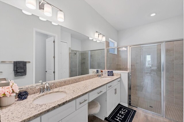 14381 Heritage Landing Blvd, Punta Gorda, FL 33955 - full bath with double vanity, a stall shower, and a sink