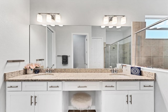 14381 Heritage Landing Blvd, Punta Gorda, FL 33955 - bathroom featuring double vanity, a stall shower, and a sink