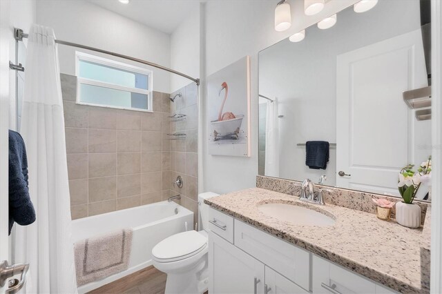 14381 Heritage Landing Blvd, Punta Gorda, FL 33955 - bathroom with wood finished floors, toilet, vanity, and shower / bathtub combination with curtain