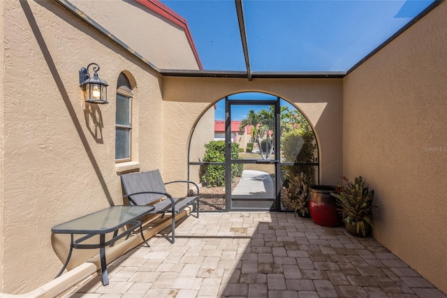 view of patio with a lanai