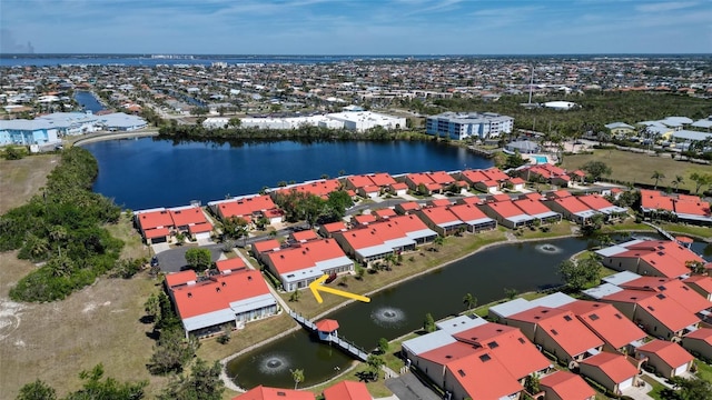 bird's eye view with a residential view and a water view