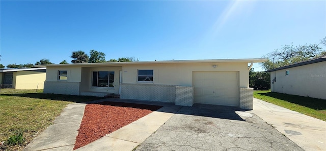 3372 Elkcam Blvd, Port Charlotte, FL 33952 - ranch-style home with brick siding, a front lawn, concrete driveway, and a garage